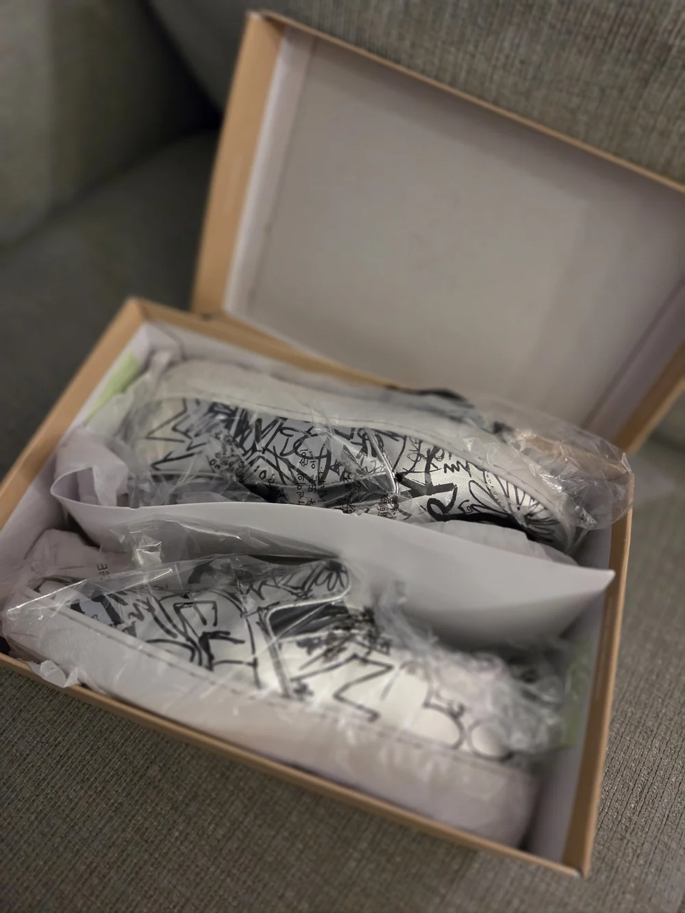 Michael Kors White Slip-On Sneakers with Black Graffiti